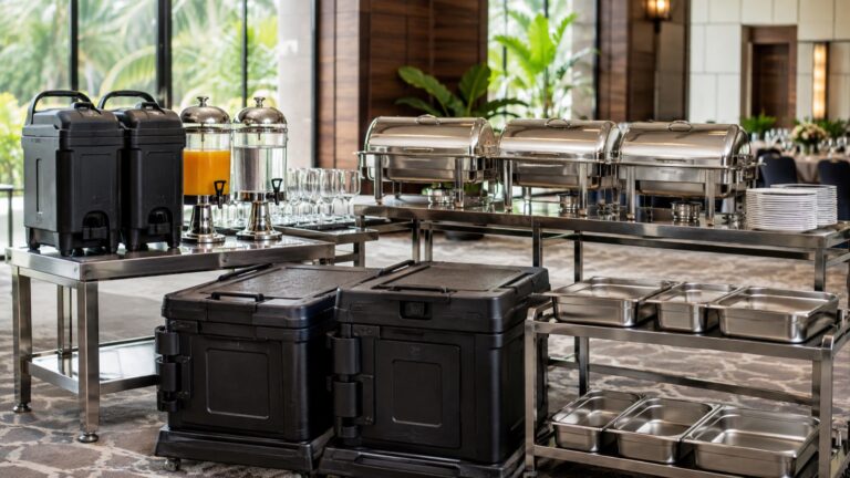 Professional catering equipment setup with buffet, beverage, transport, and service equipment for an event.